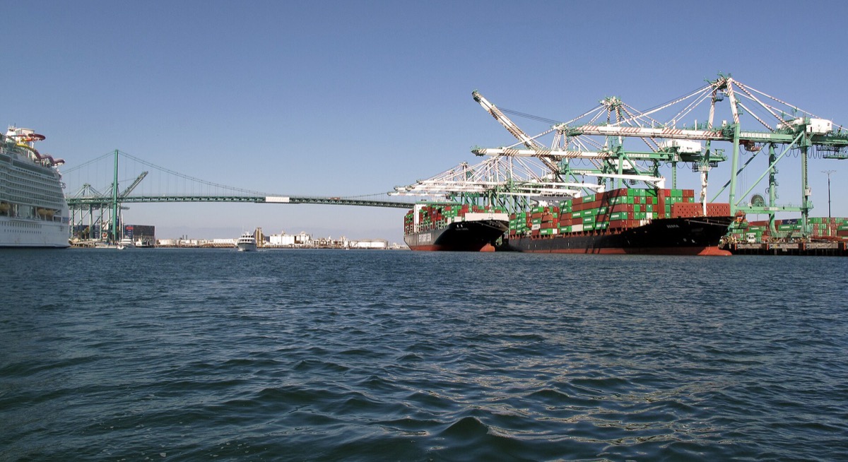 Container ships loading under gantry cranes at the Port of Los Angeles